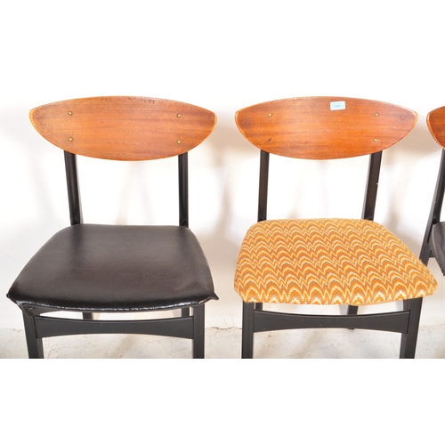 1340 - An assortment of four retro vintage 20th century teak & ebonised wood dining chairs. The lot to incl... 