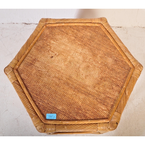 1341 - A retro vintage 20th century wicker rattan bamboo nest of three graduating tables of hexagonal shape... 