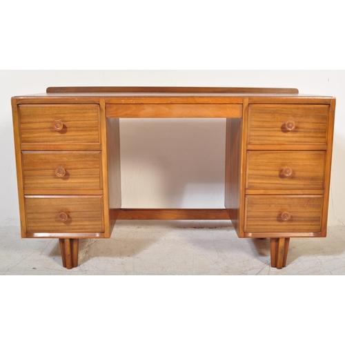 1342 - A retro vintage mid 20th century walnut office studio writing desk having a fitted gallery back on a... 