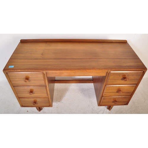 1342 - A retro vintage mid 20th century walnut office studio writing desk having a fitted gallery back on a... 