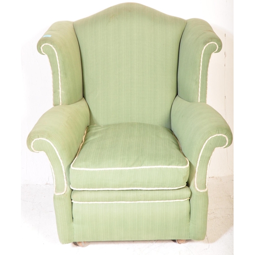 1347 - A retro vintage mid 20th century circa 1950s upholstered wingback armchair in pistachio green fabric... 