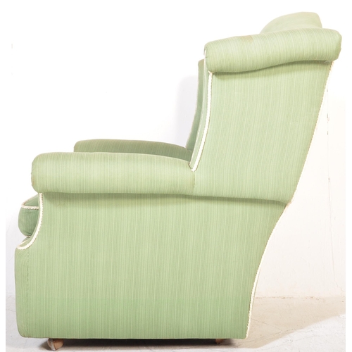 1347 - A retro vintage mid 20th century circa 1950s upholstered wingback armchair in pistachio green fabric... 