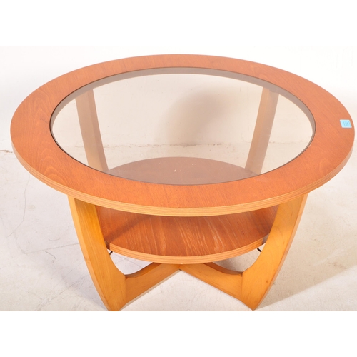 1352 - A retro vintage mid 20th century teak wood Astro style coffee table having a drop in circular glazed... 