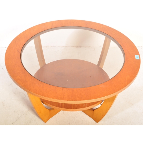 1352 - A retro vintage mid 20th century teak wood Astro style coffee table having a drop in circular glazed... 