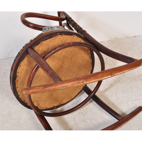 1354 - An Edwardian early 20th century bentwood rocking chair having finials atop over open back with woode... 