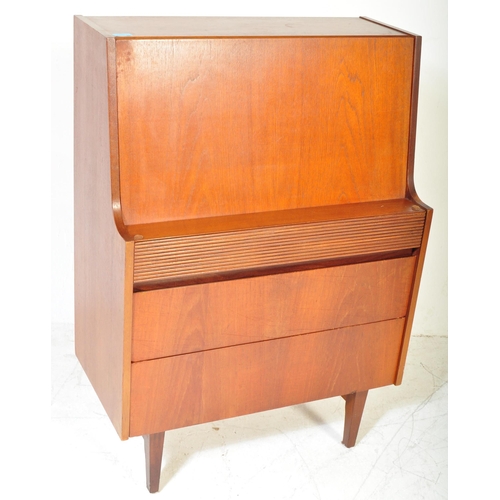 1355 - Elliotts of Newbury - A retro vintage mid 20th century circa 1950s teak writing bureau having a full... 