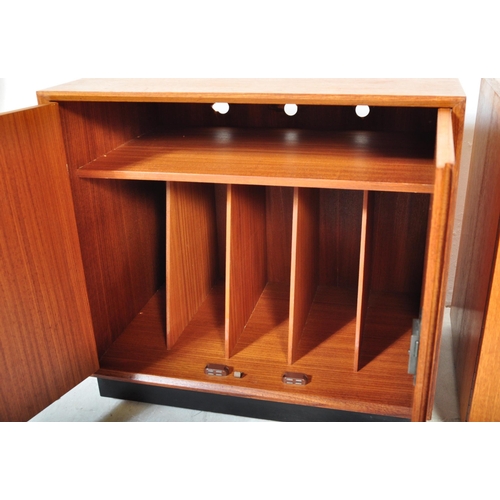 1358 - A pair of retro vintage 20th century teak wood record cabinets each having a straight top over twin ... 