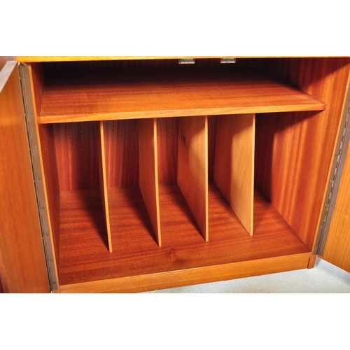 1358 - A pair of retro vintage 20th century teak wood record cabinets each having a straight top over twin ... 