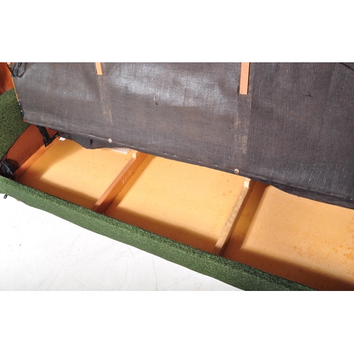 1363 - A retro vintage 20th century upholstered in dark green textured fabric four seater settee / sofa rai... 