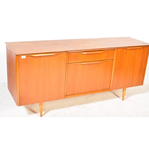 1364 - British Modern Design  - Mid century teak wood sideboard credenza. Raised on tapering legs with wide... 