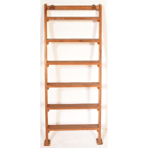 1368 - A 20th century vintage wooden ladder having metal hooks to top with vertical supports. Measures appr... 