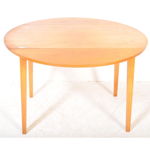 1371 - A retro vintage mid 20th Century drop leaf teak wood table. Of rectangular shape, with drop leaf eit... 