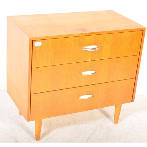 1372 - Mid century British teak veneer pedestal chest of drawers. Raised on tapering turned legs with an up... 