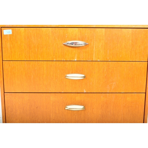 1372 - Mid century British teak veneer pedestal chest of drawers. Raised on tapering turned legs with an up... 