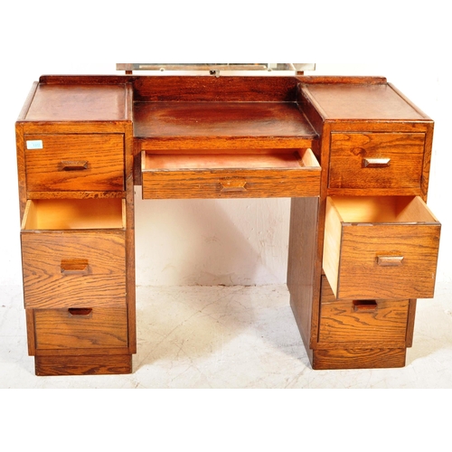 1373 - 1940's oak tallboy chest - linen cupboard and drop centre dressing table. Raised on inset plinth bas... 