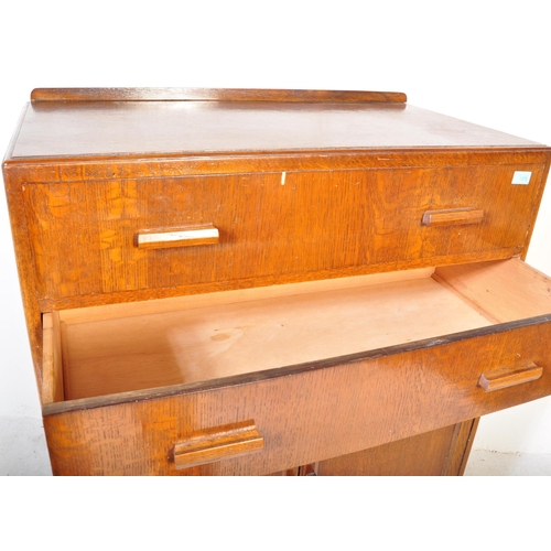 1373 - 1940's oak tallboy chest - linen cupboard and drop centre dressing table. Raised on inset plinth bas... 