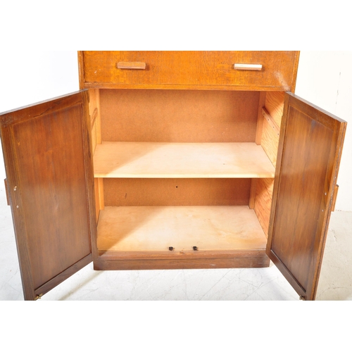 1373 - 1940's oak tallboy chest - linen cupboard and drop centre dressing table. Raised on inset plinth bas... 