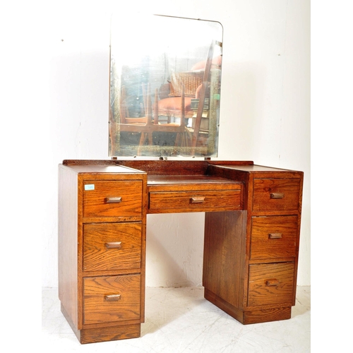 1373 - 1940's oak tallboy chest - linen cupboard and drop centre dressing table. Raised on inset plinth bas... 