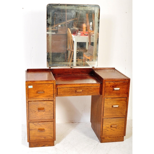 1373 - 1940's oak tallboy chest - linen cupboard and drop centre dressing table. Raised on inset plinth bas... 