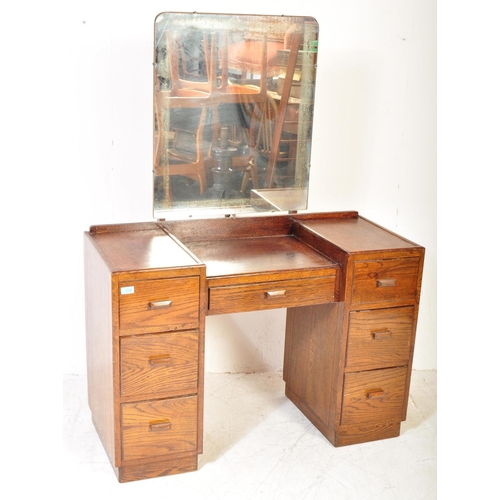 1373 - 1940's oak tallboy chest - linen cupboard and drop centre dressing table. Raised on inset plinth bas... 