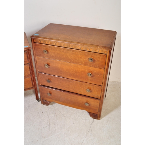 1379 - A 1940’s oak sideboard being raised on squared legs with a bank of three graduating drawers with bra... 