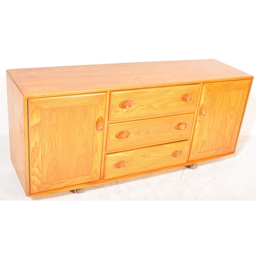 1382 - Ercol - A retro 20th century Ercol Windsor pattern blond wood beech and  elm sideboard. The credenza... 