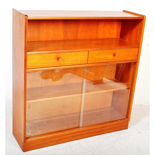 1393 - A vintage mid 20th Century teak bookcase unit. The bookcase having open recess to top above twin dra... 