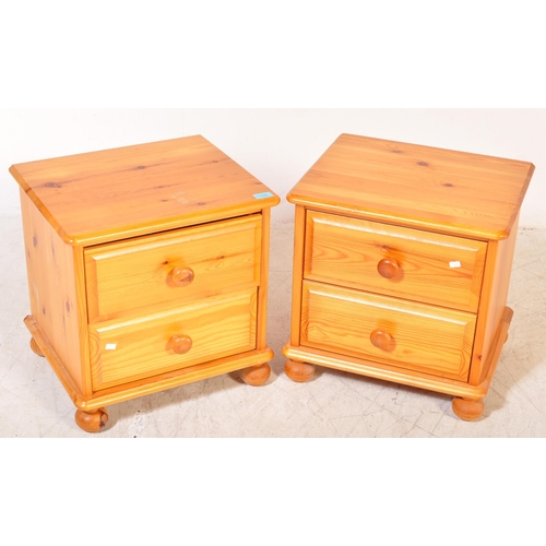 1396 - A pair of 20th Century pine bedside table cabinets. The cabinets having flared tops with a bank of t... 