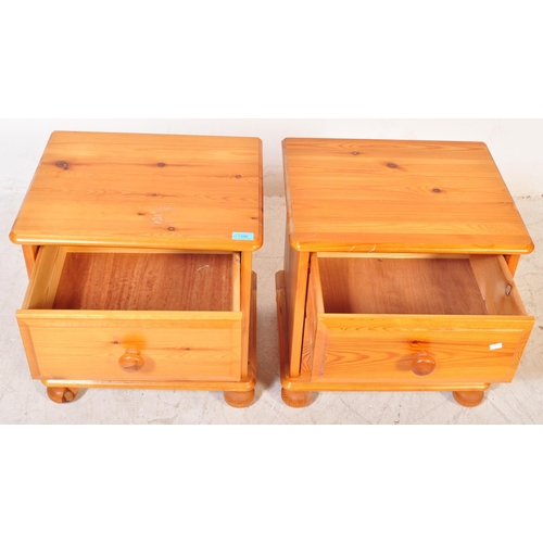 1396 - A pair of 20th Century pine bedside table cabinets. The cabinets having flared tops with a bank of t... 