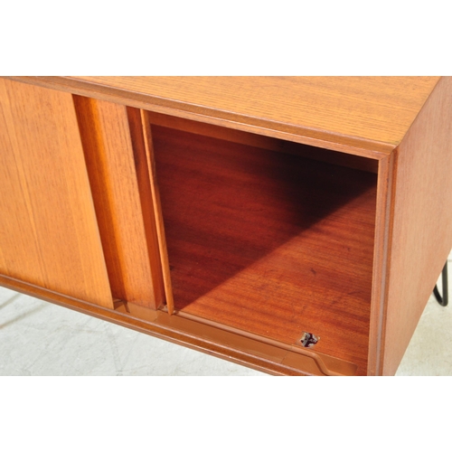 1397a - A pair of retro vintage mid 20th Century teak wood wall cabinets. Of rectangular form with twin slid... 