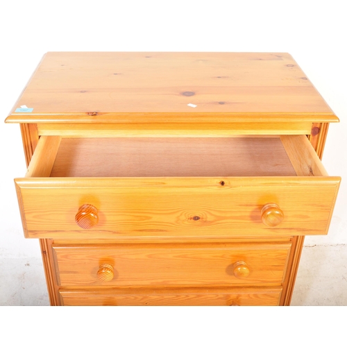 1397 - A 20th Century pine chest of drawers. The drawers having a flared top with four drawers, each with t... 