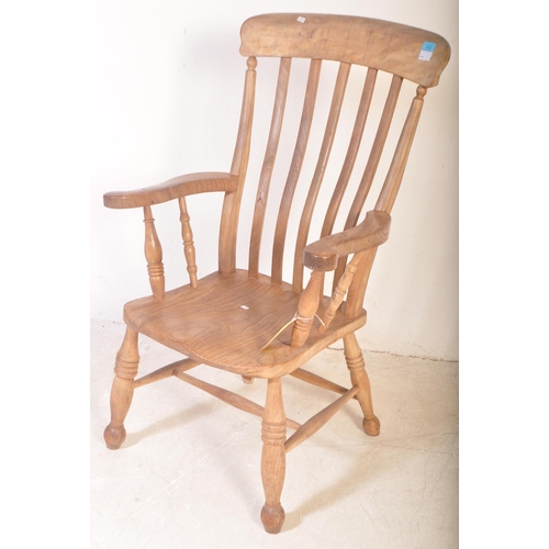 1400 - A Victorian 19th century beech and elm Windsor chair - armchair. Raised on turned legs with peripher... 