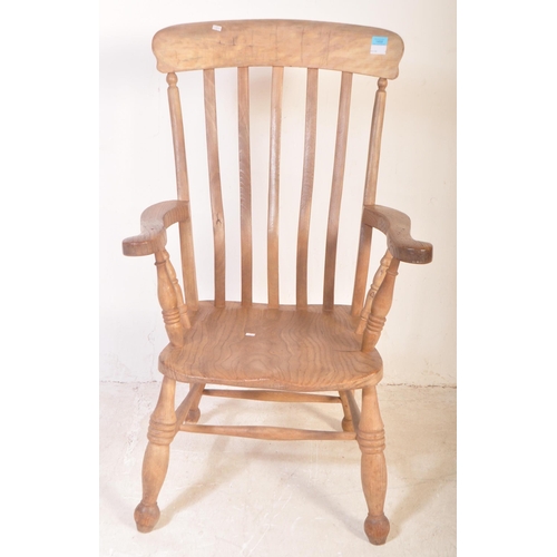 1400 - A Victorian 19th century beech and elm Windsor chair - armchair. Raised on turned legs with peripher... 