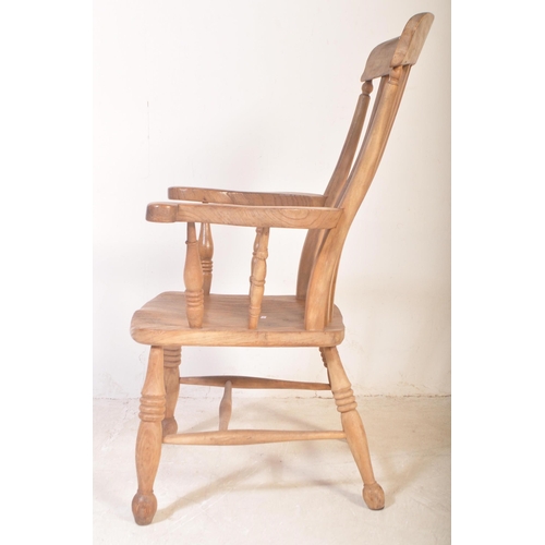 1400 - A Victorian 19th century beech and elm Windsor chair - armchair. Raised on turned legs with peripher... 