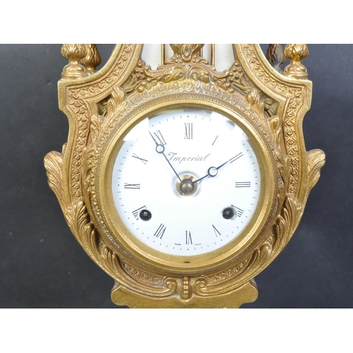 1401 - 20th century German Continental brass and marble mantel clock having a swirling finial, four rooster... 