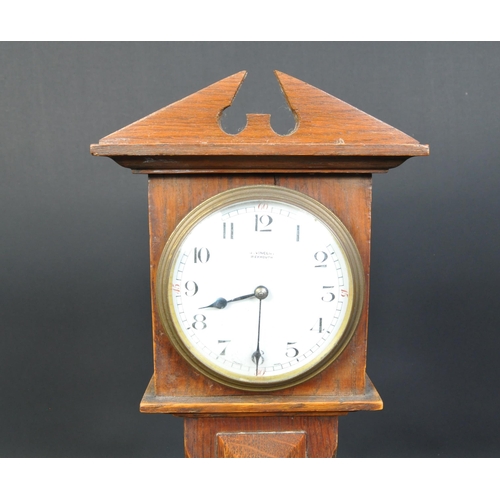 1402 - J. Vincent of Weymouth - An early 20th century miniature apprentice longcase clock. The clock having... 