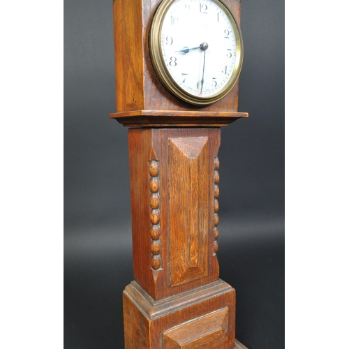 1402 - J. Vincent of Weymouth - An early 20th century miniature apprentice longcase clock. The clock having... 