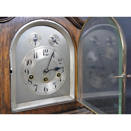 1404 - An early 20th  Century Oak Cased Mantel - bracket Clock. The clock with Westminster Chime movement b... 