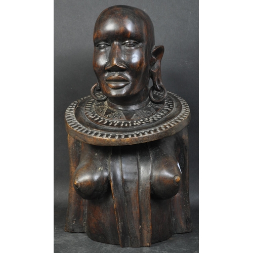 1406 - A large African tribal statue bust of impressive size  depicting a Congolese female warrior with nec... 