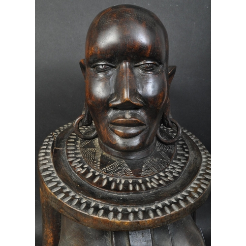 1406 - A large African tribal statue bust of impressive size  depicting a Congolese female warrior with nec... 