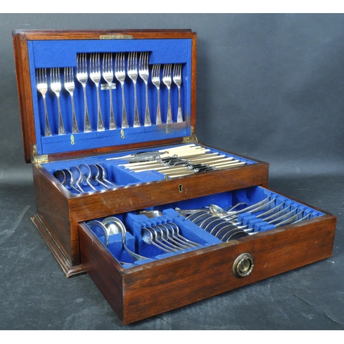 1409 - Edwardian mahogany cased 12 place setting canteen of cutlery. Mahogany case with drawer having baize... 