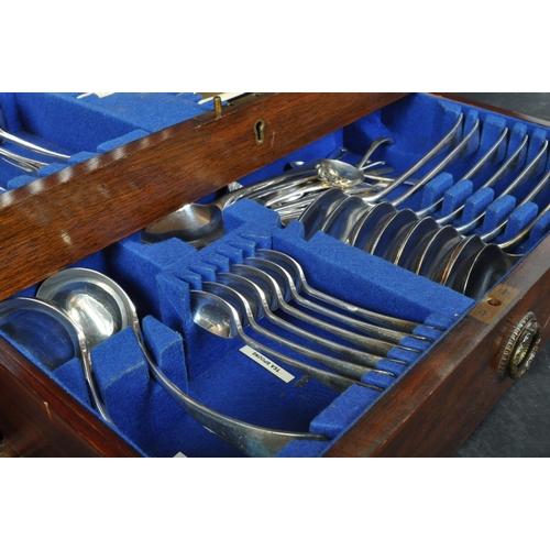 1409 - Edwardian mahogany cased 12 place setting canteen of cutlery. Mahogany case with drawer having baize... 