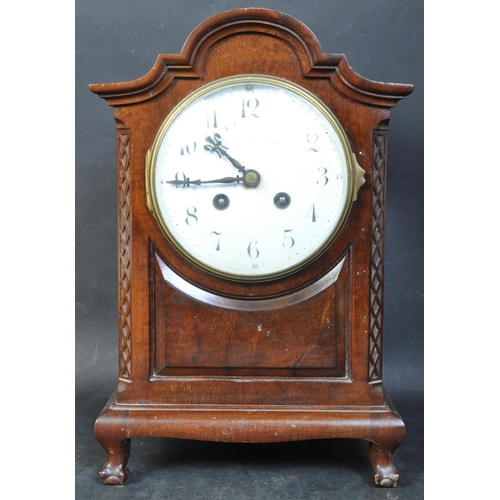 1410 - An Edwardian mahogany 8 day mantel clock by Japy Freres of Paris. Ball and claw feet with blind fret... 