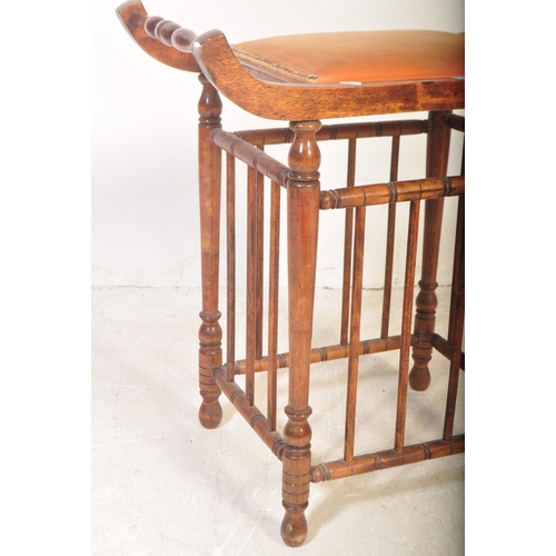 1412 - Edwardian mahogany Aesthetic movement piano stool. Raised on turned legs with peripheral full height... 