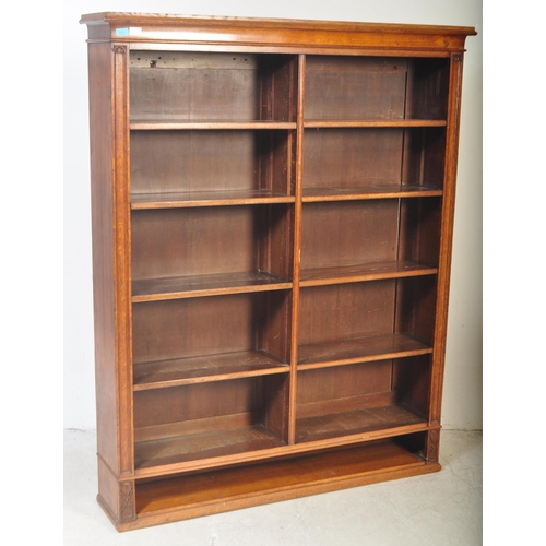 1419 - Large Victorian oak floor standing double bookcase. Carved detailing to the sides with reeded edges ... 