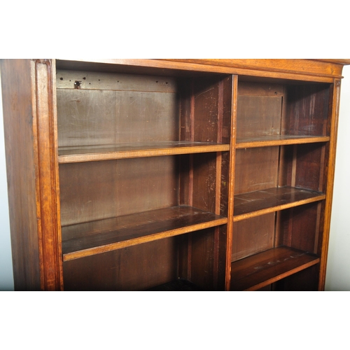 1419 - Large Victorian oak floor standing double bookcase. Carved detailing to the sides with reeded edges ... 