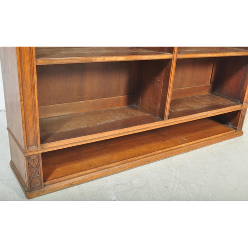 1419 - Large Victorian oak floor standing double bookcase. Carved detailing to the sides with reeded edges ... 