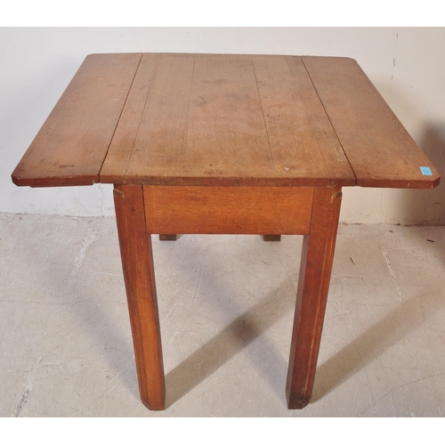 1421 - An early 20th century French provincial drop leaf solid dining table being raised on squared legs wi... 