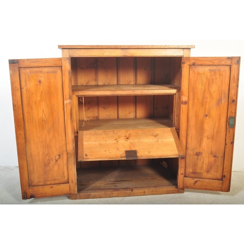 1422 - A Victorian 19th century pine school cupboard. Full length twin doors having white ceramic handle an... 