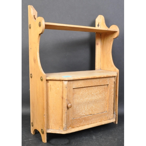 1426 - A Victorian 19th century pine hanging cabinet. Shelf over single twin door cupboard with shaped upri... 